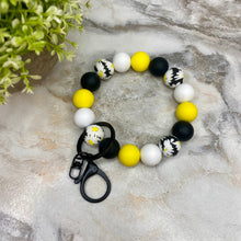 Load image into Gallery viewer, Silicone Bracelet Keychain - Black Yellow White Daisy
