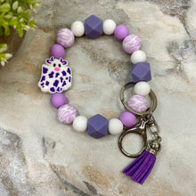 Load image into Gallery viewer, Silicone Bracelet Keychain with Tassel - Cow - Purple
