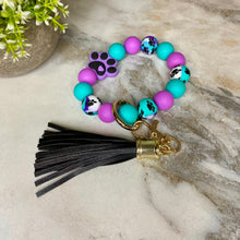 Load image into Gallery viewer, Silicone Bracelet Keychain - Paw Print Purple &amp; Teal
