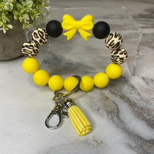 Load image into Gallery viewer, Silicone Bracelet Keychain - Yellow Bow
