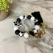 Load image into Gallery viewer, Silicone Bracelet Keychain - Paw Print Black

